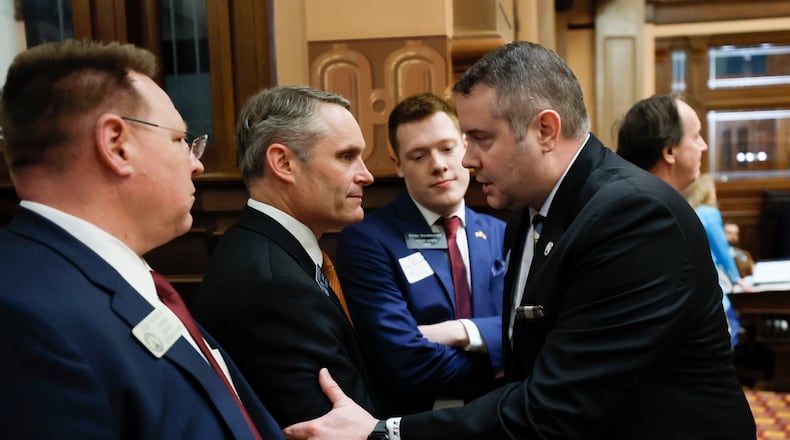 Sen. Ed Setzler, R - Acworth, is congratulated by State Rep. Will Wade, R-Dawsonville after the passing of the SB 36, a "religious liberty" bill, during Legislative Day 39 at the Georgia State Capitol on Wednesday, April 2, 2025.
(Miguel Martinez/ AJC)