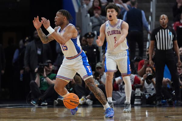 Florida guard Alijah Martin (15) and guard Walter Clayton Jr. react to a call during the second half in the Elite Eight of the NCAA college basketball tournament against Texas Tech, Saturday, March 29, 2025, in San Francisco. (AP Photo/Marcio Jose Sanchez)