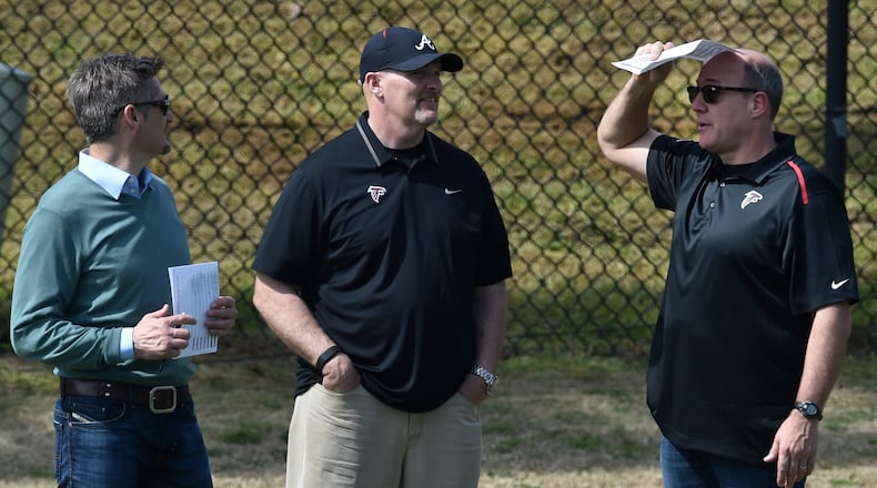 March 16, 2106 Athens, GA: Atlanta Falcons General Manager Thomas Dimitroff, head coach Dan Quinn and assistant General Manager Scott Pioli confer during Pro Day at the University of Georgia Wednesday March 16, 2016. Players, who have wrapped up their college careers, participated in a set of predetermined skills designed to test their strength, speed and agility in hopes of impressing NFL scouts. BRANT SANDERLIN/BSANDERLIN@AJC.COM