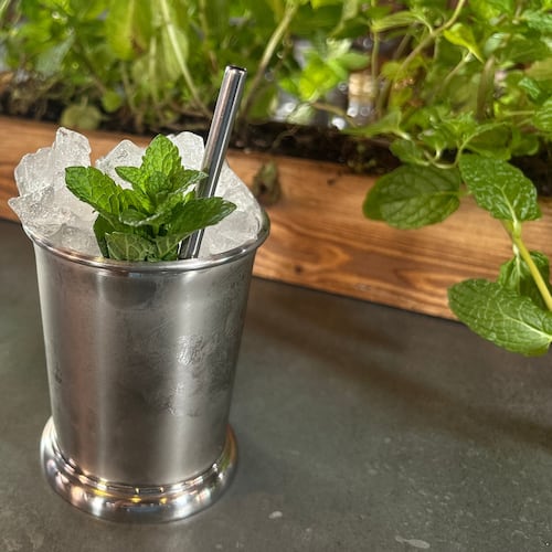 A Mint Julep cocktail is displayed at the cocktail bar Cato in London on April 22, 2026. (AP Photo/Louise Dixon)