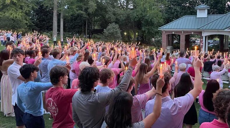 Students hold candles at a vigil to honor the life of Marietta High student Liv Teverino, who was killed in a car accident on Monday. The vigil took place at Marietta First United Methodist Church on Wednesday, Sept. 20, 2023. (Courtesy of Sarah Bullington)