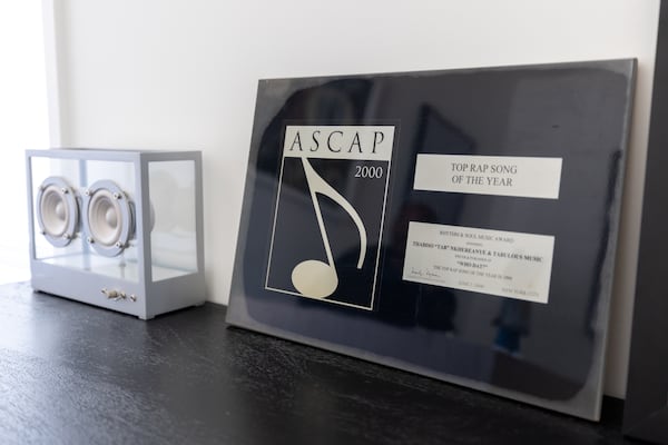 A view of an ASCAP award for top rap song of 2000 ("Who Dat") sits in the home office of Tab Nkhereanye, senior vice president of Artists & Repertoire at BMG. (Arvin Temkar/AJC)