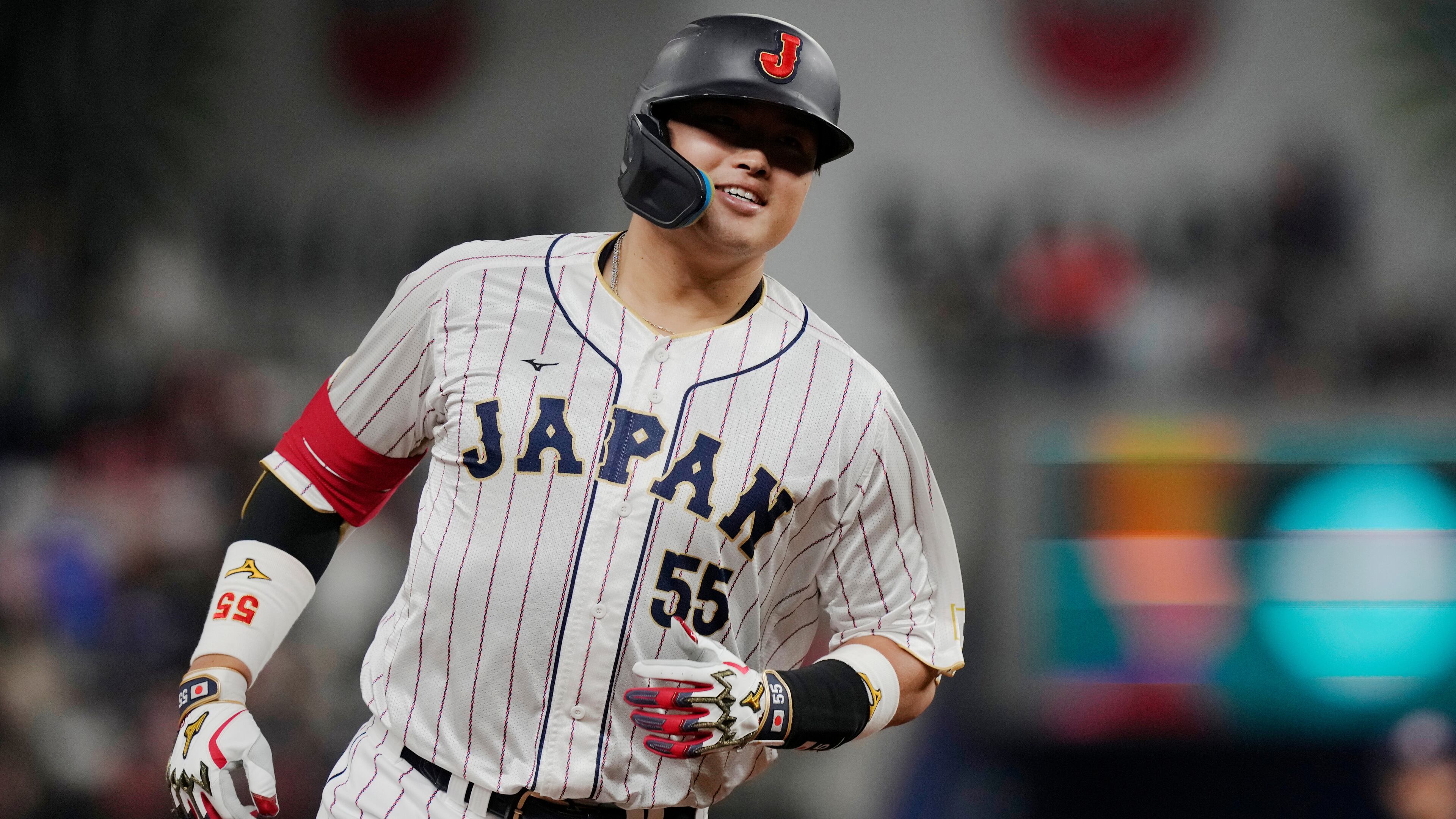 FILE - Japan third baseman Munetaka Murakami (55) runs the bases after hitting a home run during the second inning of a World Baseball Classic game against the United States, Tuesday, March 21, 2023, in Miami. (AP Photo/Marta Lavandier, File)