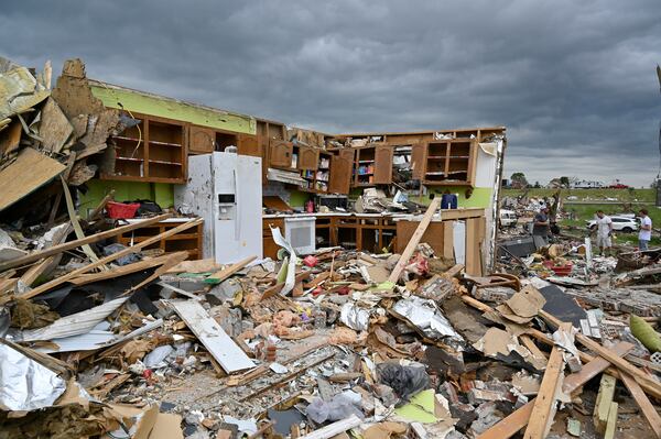FILE - The remains of a kitchen surrounded by debris after severe storms in the Sunshine Hills neighborhood in London, Ky., May 19, 2025. (AP Photo/Timothy D. Easley, File)