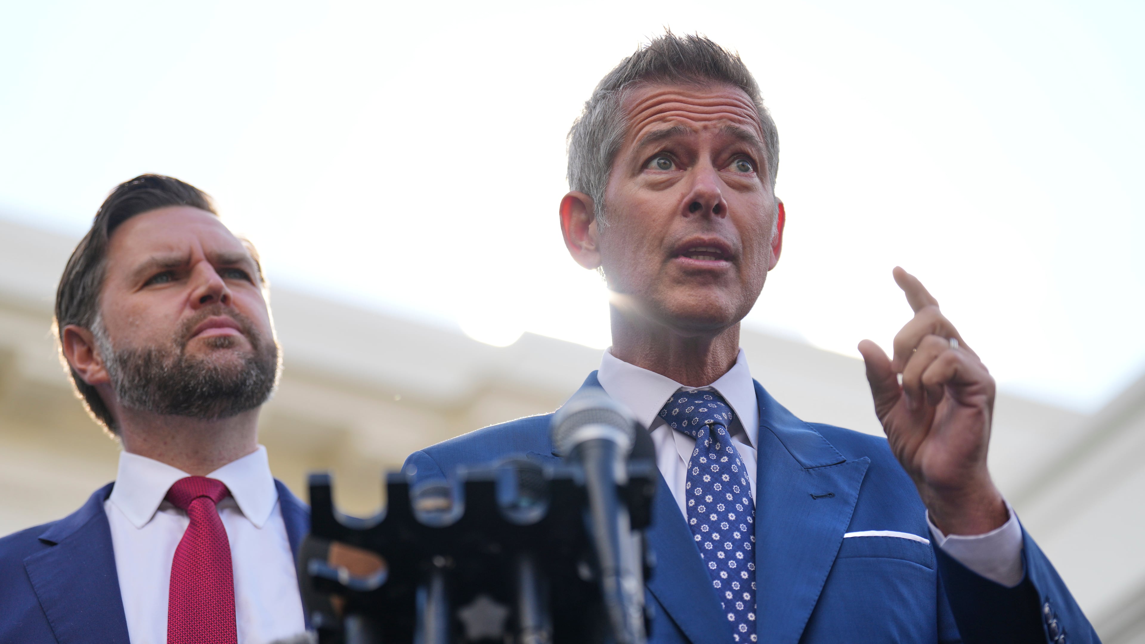 Transportation Secretary Sean Duffy speaks alongside Vice President JD Vance about the impact of the government shutdown on the aviation industry, outside of the West Wing of the White House, Thursday, Oct. 30, 2025, in Washington. (AP Photo/Jacquelyn Martin)