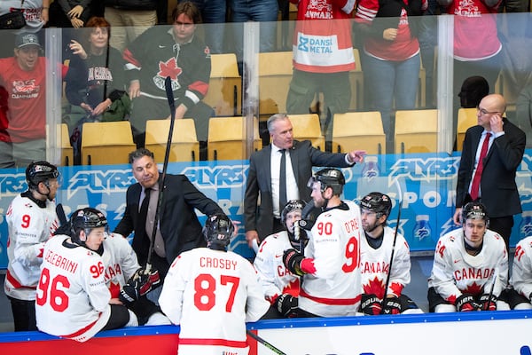 Canada's head coach Dean Evason, center rear, and his team react after a quarterfinal game between Canada and Denmark at the hockey world championships, Thursday, May 22, 2025, in Herning, Denmark. (Bo Amstrup/Ritzau Scanpix via AP)