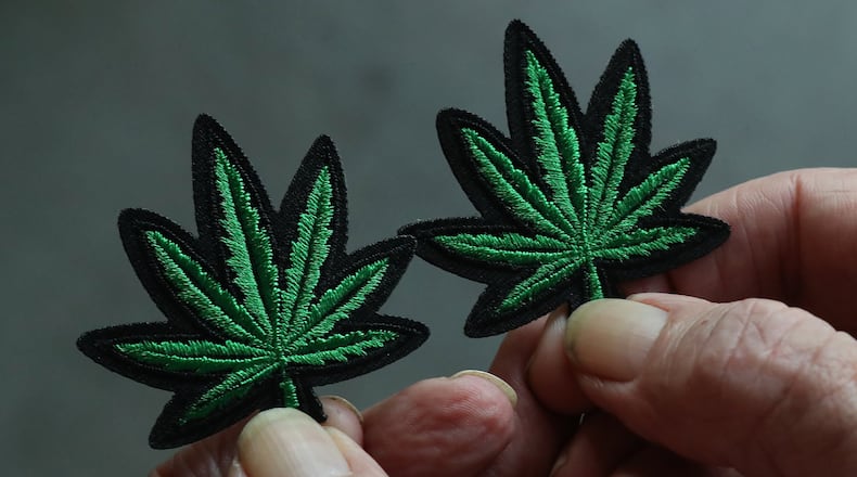 October 1, 2019 Atlanta: Board member Kelly Hammock sets out merchandise including leaf patches during a monthly meeting of NORML Peachtree, a state group advocating normalization of marijuana at Manuel’s Tavern on Tuesday, October, 1, 2019, in Atlanta. Curtis Compton/ccompton@ajc.com