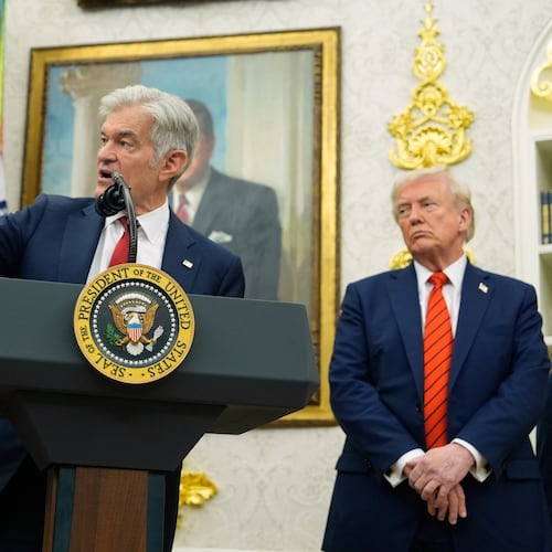 President Donald Trump listens as Centers for Medicare & Medicaid Services administrator Dr. Mehmet Oz speaks in the Oval Office of the White House, Friday, Oct. 10, 2025, in Washington. (AP Photo/Alex Brandon)