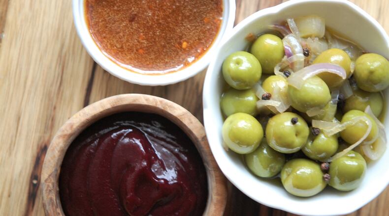 Sweet-and-sour sauces and condiments are prevalent in many global food cultures. Styling and photo by Meridith Ford for The AJC