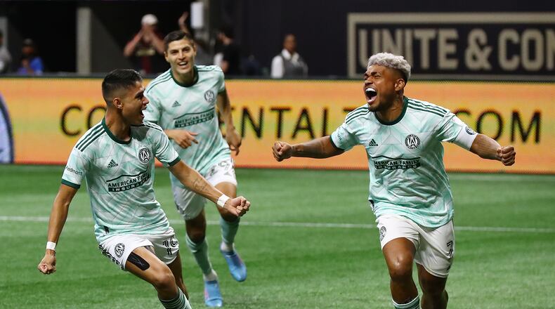 061922 Atlanta: Atlanta United attacker Luiz De Araujo (left) celebrates his goal with the assist from attacker Josef Martinez (right) to take a 1-0 lead over Inter Miami in a MLS soccer match on Sunday, June 19, 2022, in Atlanta. “Curtis Compton / Curtis.Compton@ajc.com”