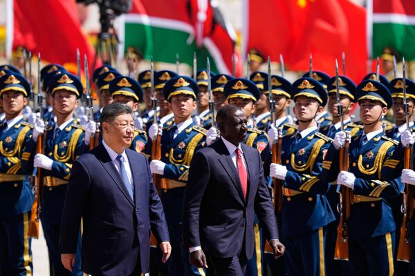 Chinese President Xi Jinping, left, and Kenyan President William Ruto attend a welcome ceremony at the Great Hall of the People Thursday, April 24, 2025 in Beijing, China. (Iori Sagisawa/Pool Photo via AP)
