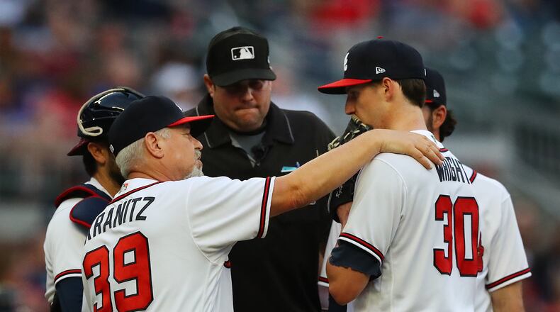 051022 Atlanta: Atlanta Braves pitching coach Rick Kranitz confers with starting pitcher Kyle Wright against the Boston Red Sox during the second inning of a MLB baseball game on Tuesday, May 10, 2022, in Atlanta.    “Curtis Compton / Curtis.Compton@ajc.com”