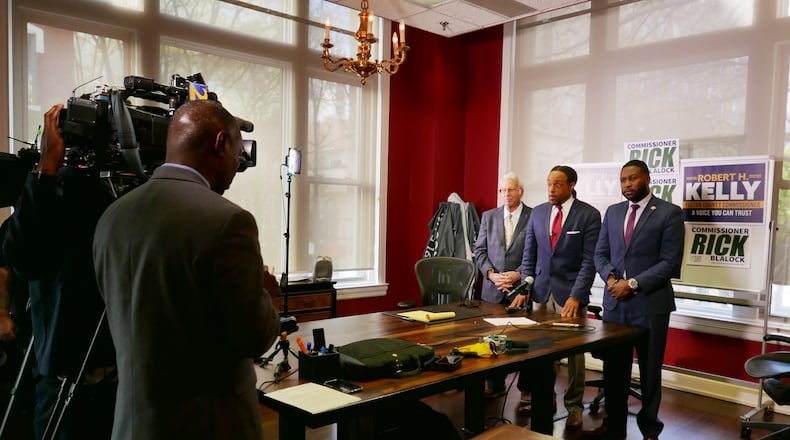 Attorney David Betts, Rick Blalock and Robert Kelly at a press conference on Friday.