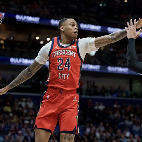 FILE - New Orleans Pelicans guard Jordan Hawkins (24) blocks the shot of Utah Jazz guard Kennedy Chandler (0) during the first half of an NBA basketball game in New Orleans, April 7, 2026. (AP Photo/Matthew Hinton, File)