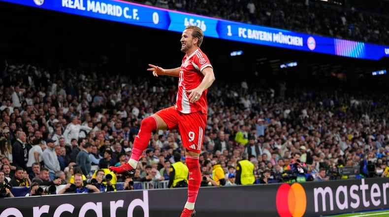 Bayern's Harry Kane celebrates scoring his side's second goal during the Champions League quarterfinal first leg soccer match between Real Madrid and Bayern Munich in Madrid, Spain, Tuesday, April 7, 2026. (AP Photo/Jose Breton)
