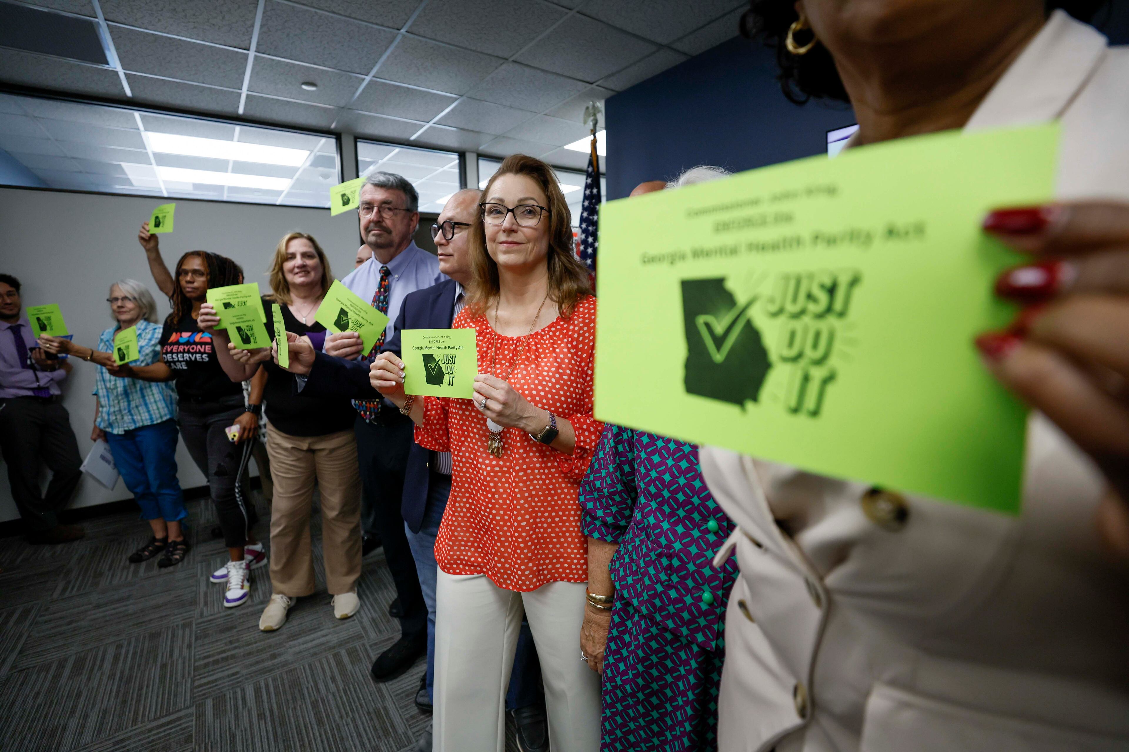 Mental health advocates and leaders gathered in the Sloppy Floyd Capitol Room at the Office of the Commissioner of Insurance and Safety Fire to deliver postcards supporting equal insurance coverage for mental health care on Monday, August 18, 2025.
(Miguel Martinez/ AJC)