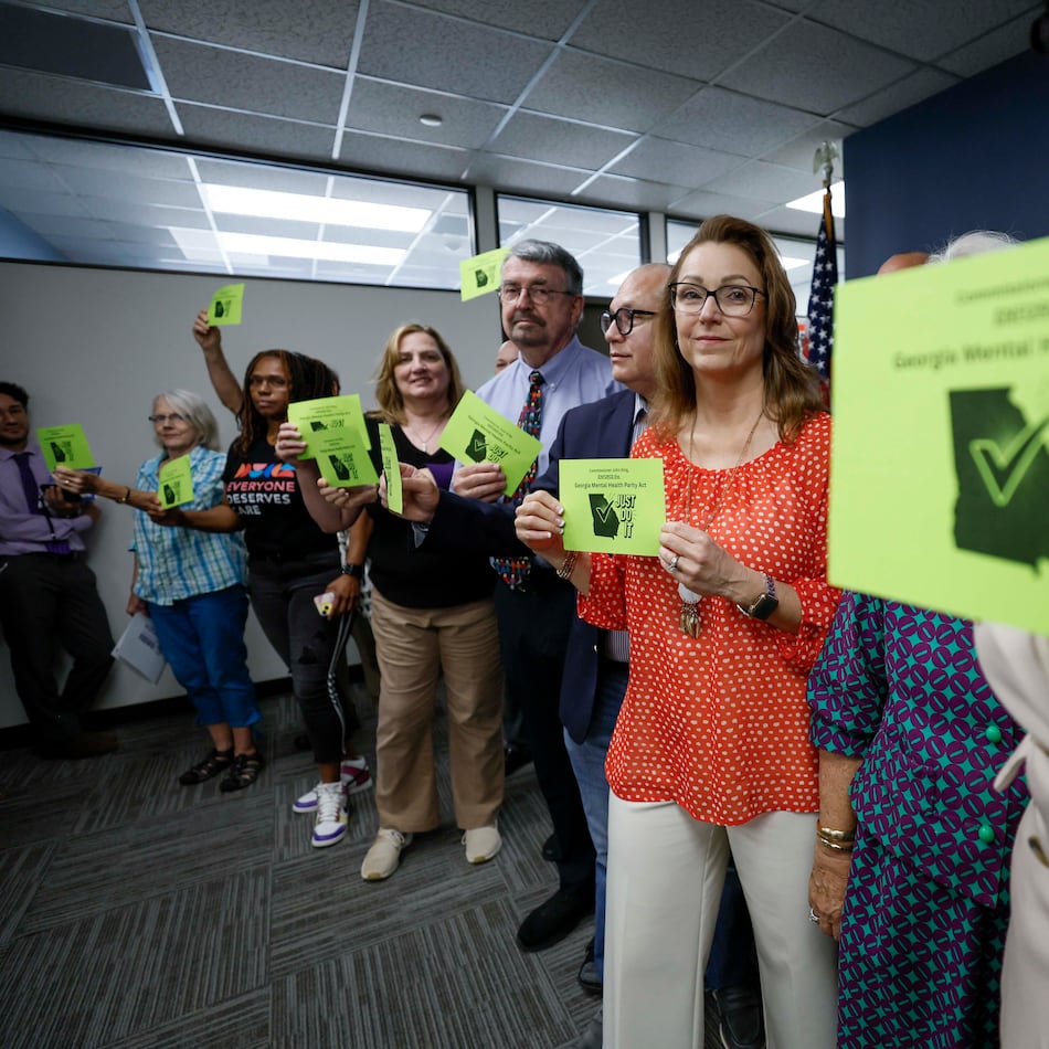 Mental health advocates and leaders gathered in the Sloppy Floyd Capitol Room at the Office of the Commissioner of Insurance and Safety Fire to deliver postcards supporting equal insurance coverage for mental health care last August. (Miguel Martinez/AJC 2025)
