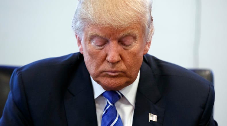 Republican presidential candidate Donald Trump pauses during a meeting with members of the National Border Patrol Council at Trump Tower, Friday, Oct. 7, 2016, in New York. (AP Photo/ Evan Vucci)