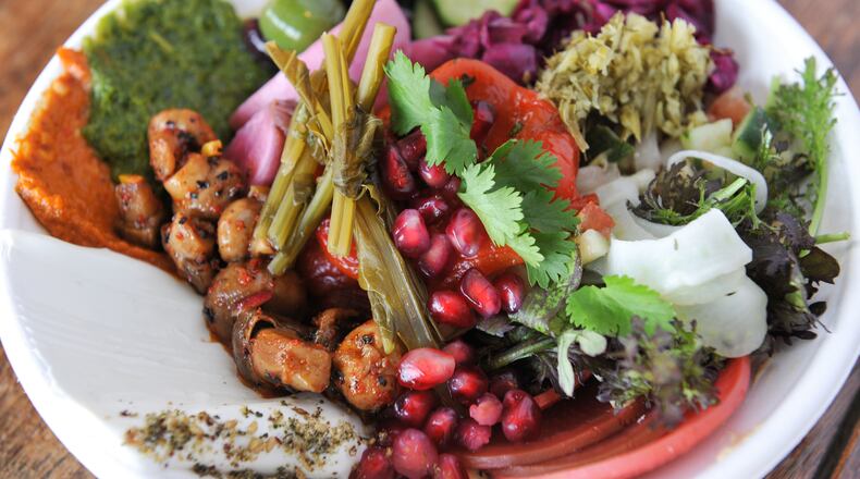 141229-ATLANTA-GA- Dine review of Todd Ginsbergs new counters Yalla and Fred's Meat & Bread, inside the Krog St Market, on Thursday January 1, 2015. FOOD: Salatim Bowl at Yalla. (Beckysteinphotography.com) Salatim bowl at Yalla! (photo by Becky Stein)
