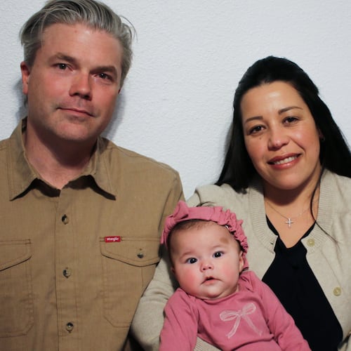 Stephen and Yurany Dexter hold their 4-month-old daughter, who was recently hospitalized for botulism, at their home in Flagstaff, Ariz. on Wednesday, Nov. 12, 2025. (AP Photo/Cheyanne Mumphrey)