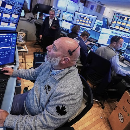 Trader Vincent Napolitono, foreground, works on the floor of the New York Stock Exchange, Thursday, Nov. 20, 2025. (AP Photo/Richard Drew)