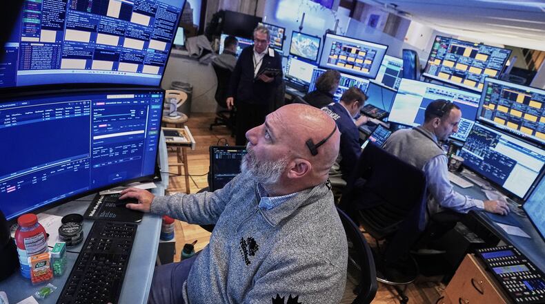 Trader Vincent Napolitono, foreground, works on the floor of the New York Stock Exchange, Thursday, Nov. 20, 2025. (AP Photo/Richard Drew)