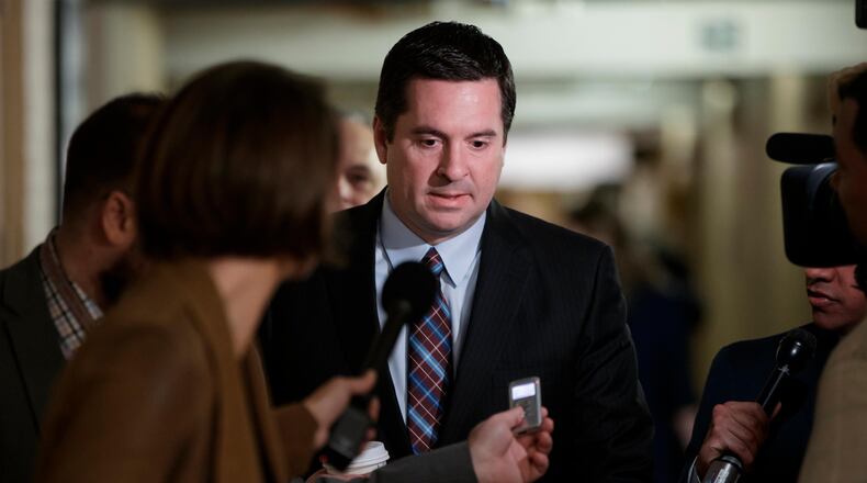 FILE - In this March 28, 2017 file photo, House Intelligence Committee Chairman Rep. Devin Nunes, R-Calif. is pursued by reporters on Capitol Hill in Washington. Nunes says he’s temporarily stepping aside from Russia probe amid ethics accusations. (AP Photo/J. Scott Applewhite, File)