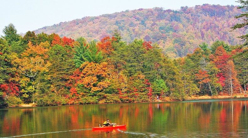 Early November color at Fort Mountain State Park’s lake in Murray County. Why some leaves turn red and others turn yellow or orange in fall depends on chemicals and pigments in the leaves. CHARLES SEABROOK