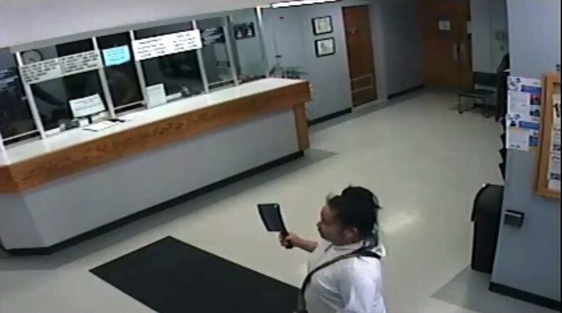 Police say woman armed with a cleaver took another woman hostage in the Salinas Police Department lobby.