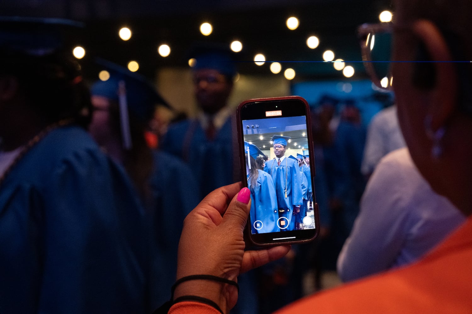 Graduates of Goodwill of North Georgia job training program and career development programs process in for a graduation ceremony at the Georgia Aquarium in Atlanta on Monday, June 9, 2025.   Ben Gray for the Atlanta Journal-Constitution