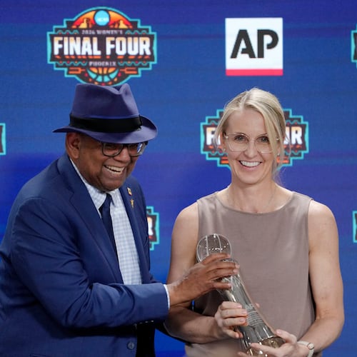 Associated Press deputy global sports editor Oscar Dixon, left, presents Vanderbilt women's basketball head coach Shea Ralph with the 2026 AP Women's Coach of the Year award during a news conference at the Women's Final Four of the NCAA college basketball tournament, Thursday, April 2, 2026, in Phoenix. (AP Photo/Ross D. Franklin)