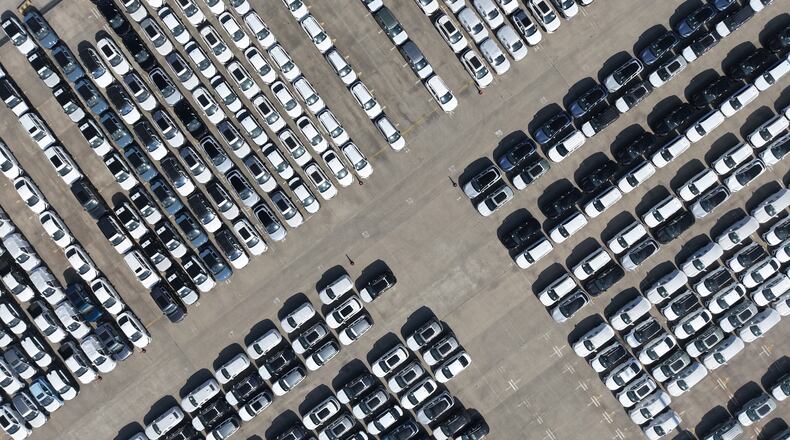FILE -An aerial view of new cars awaiting export to oversea markets is seen at a port in Shanghai, March 10, 2026. (Chinatopix via AP, File)