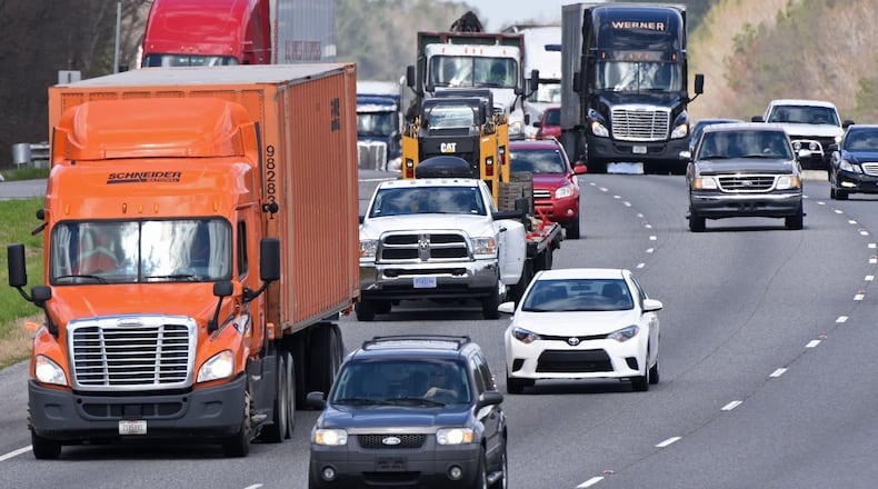 The mix of trucks and cars on I-75 near the Barnesville-Jackson Road overpass in Jackson, Ga. HYOSUB SHIN / HSHIN@AJC.COM