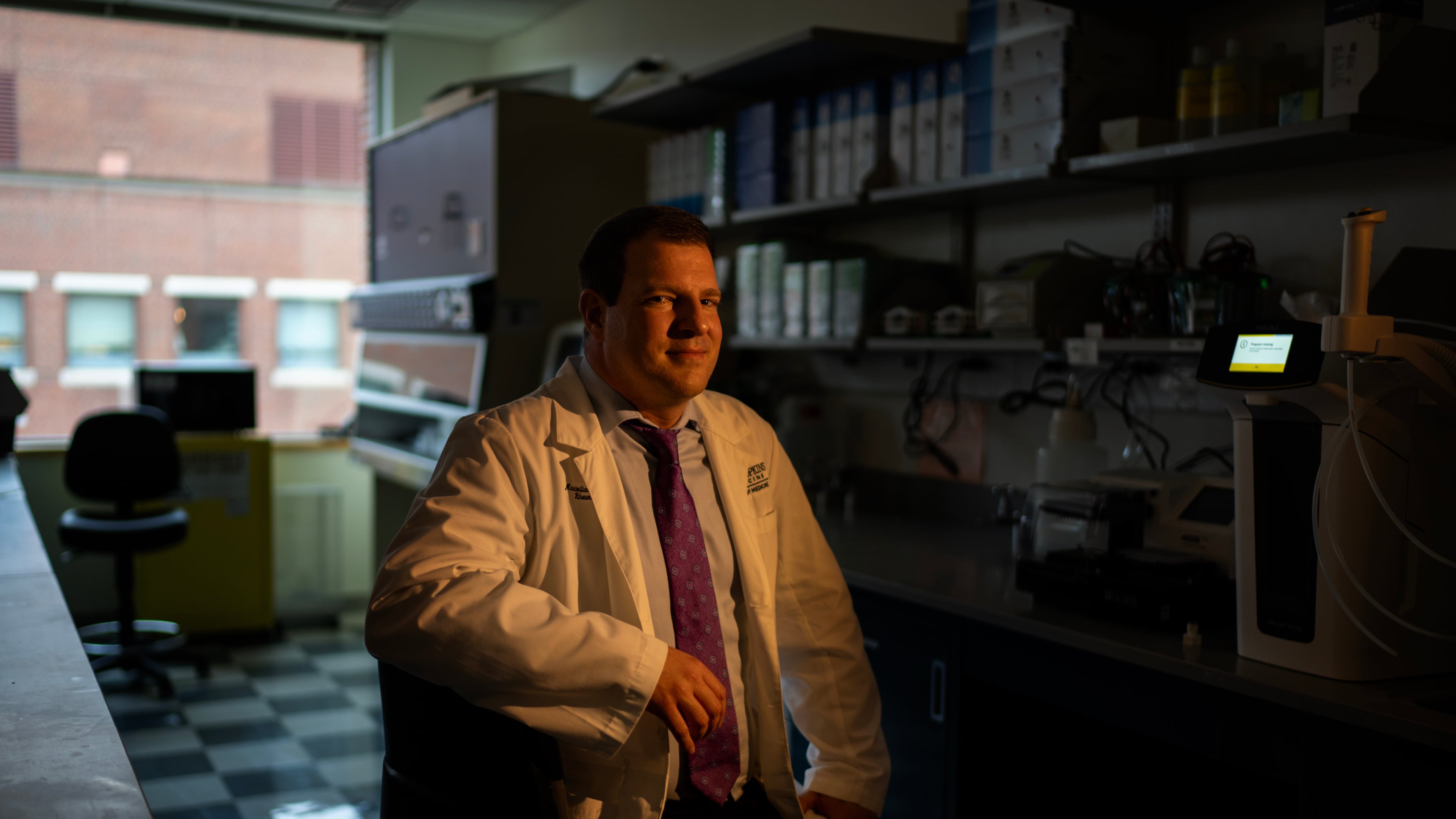 Dr. Maximilian Konig, a rheumatologist at Johns Hopkins University, sits for a portrait in the lab where he's studying some possible new treatments for autoimmune diseases, Tuesday, May 13, 2025, in Baltimore, Md. (AP Photo/David Goldman)
