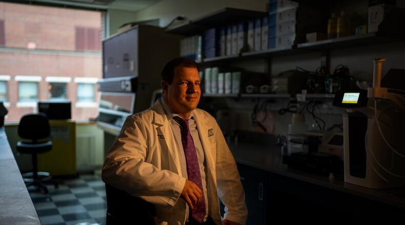 Dr. Maximilian Konig, a rheumatologist at Johns Hopkins University, sits for a portrait in the lab where he's studying some possible new treatments for autoimmune diseases, Tuesday, May 13, 2025, in Baltimore, Md. (AP Photo/David Goldman)
