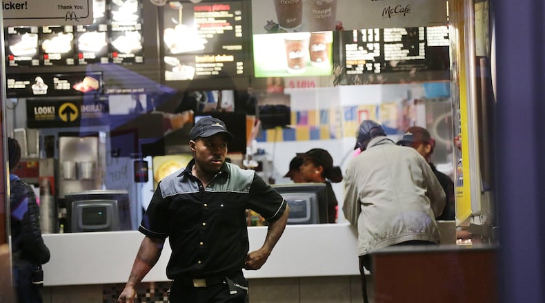NEW YORK, NY - NOVEMBER 10: A McDonalds worker walks in a restaurant on November 10, 2015 in New York, United States. In what organizers are calling a National Day of Action for $15 and hour minimum wage, thousands of people took to the streets across the country to stage protests in front of businesses that are paying some of their workers the minimum wage. Home care workers, employees in retail and fast food restaurants say that the current minimum is not a living wage. (Photo by Spencer Platt/Getty Images)