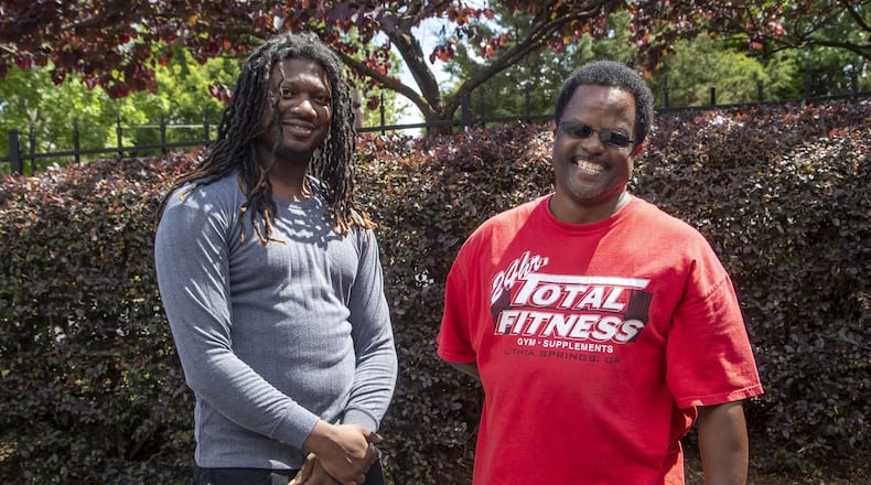 Alexander Harris (right) speaks with Johnny Eubanks outside of Harris’ residence in Atlanta’s Mechanicsville neighborhood. Harris has been a part of Eubanks’ life since Eubanks was 12. Eubanks says Harris taught him, among other things, how to be a family man and care for his children. ALYSSA POINTER / ALYSSA.POINTER@AJC.COM