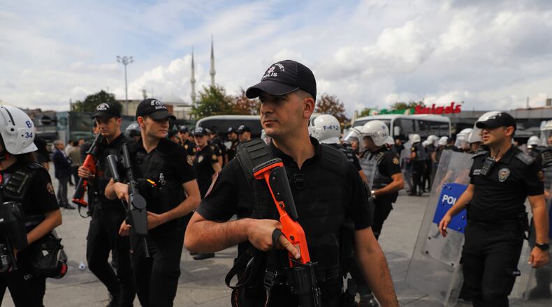 Turkish police stand guard outside a courthouse after preventing LGBTQ+ rights supporters from holding a news conference in Istanbul, Turkey, Tuesday, Sept. 15, 2026. (AP Photo/Dilara Acikgoz)