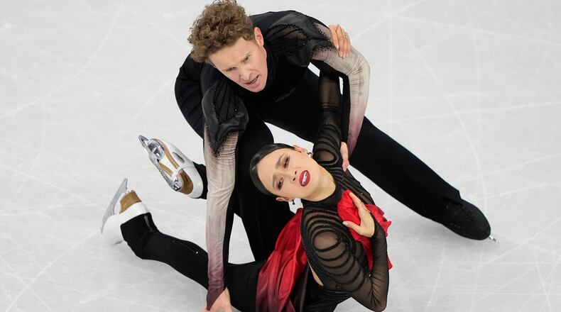 Madison Chock and Evan Bates of the United States compete during the ice dancing free skate in figure skating at the 2026 Winter Olympics, in Milan, Italy, Wednesday, Feb. 11, 2026. (AP Photo/Natacha Pisarenko)