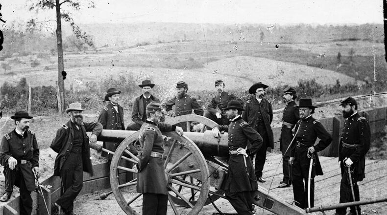 Gen. William T. Sherman, with hand on breech of cannon, at an Atlanta fort. George Barnard/Library of Congress