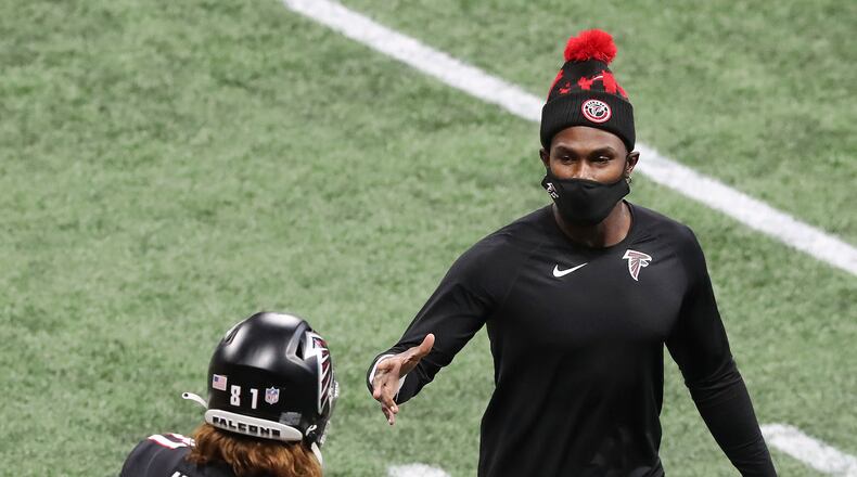 122020 Atlanta: Atlanta Falcons tight end Hayden Hurst gets five from Julio Jones after scoring a touchdown against the Tampa Bay Buccaneers during the 3rd quarter in a NFL football game on Sunday, Dec. 20, 2020, in Atlanta. “Curtis Compton / Curtis.Compton@ajc.com”