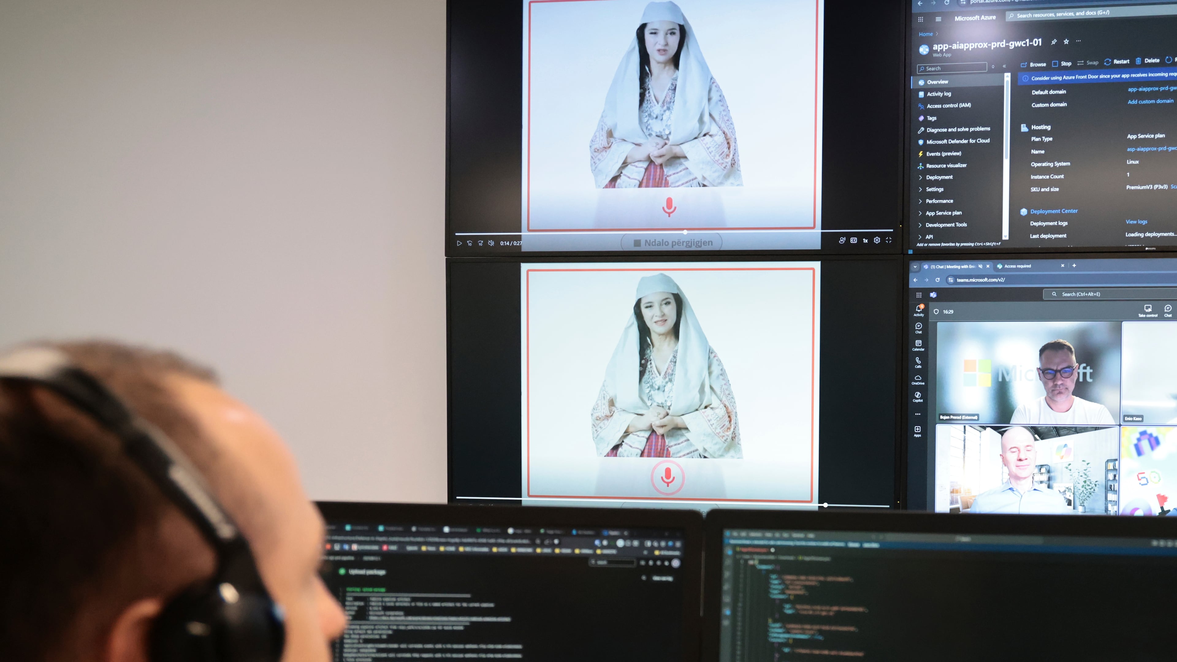 An Albanian expert works at the National Agency for Information Society as an artificial intelligence "minister" Diella, whose name means "Sun" in Albanian, is seen on the screens in Tirana, Albania, Friday, Sept. 12, 2025. (AP Photo/Vlasov Sulaj)