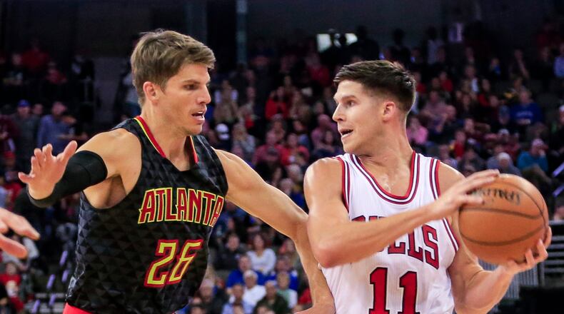 Chicago Bulls forward Doug McDermott (11) is guarded by Atlanta Hawks guard Kyle Korver (26) during the first half of an NBA preseason basketball game in Omaha, Neb., Thursday, Oct. 20, 2016. (AP Photo/Nati Harnik)