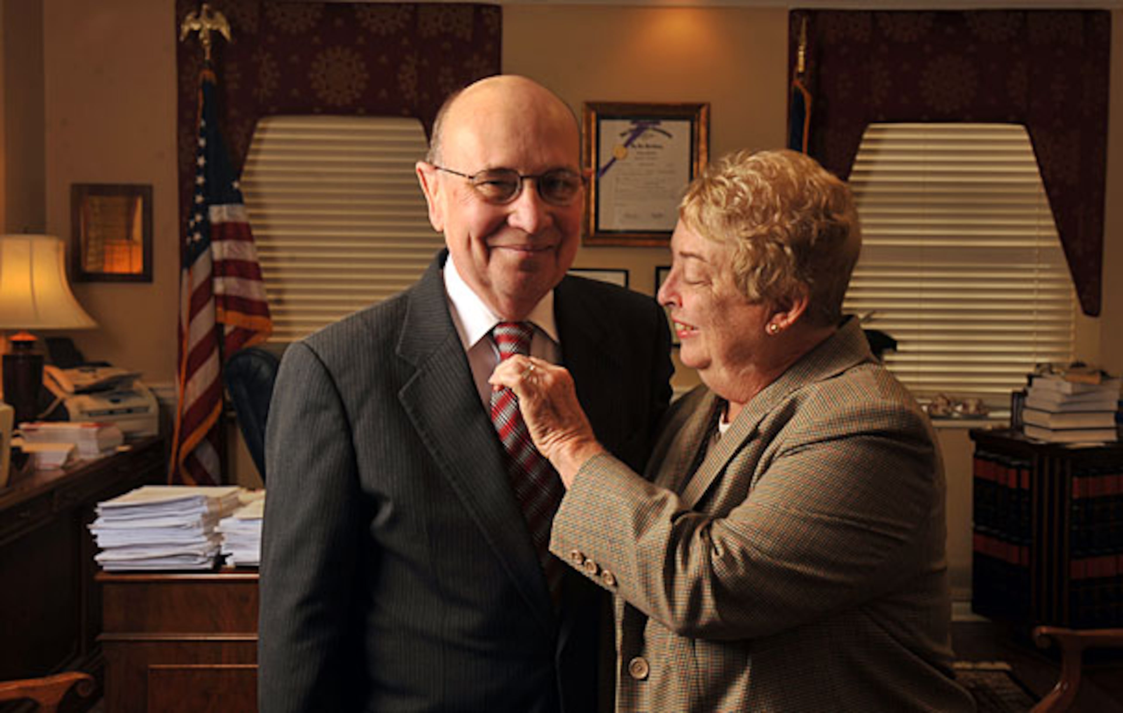 George Carley (shown with wife Sandy) was well known for always wearing a coat and tie. (AJC FILE)