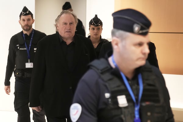 Actor Gerard Depardieu, center, who is facing trial for the alleged sexual assaults of two women on a film set in 2021, arrives Monday, March 24, 2025 in Paris. (AP Photo/Thibault Camus)