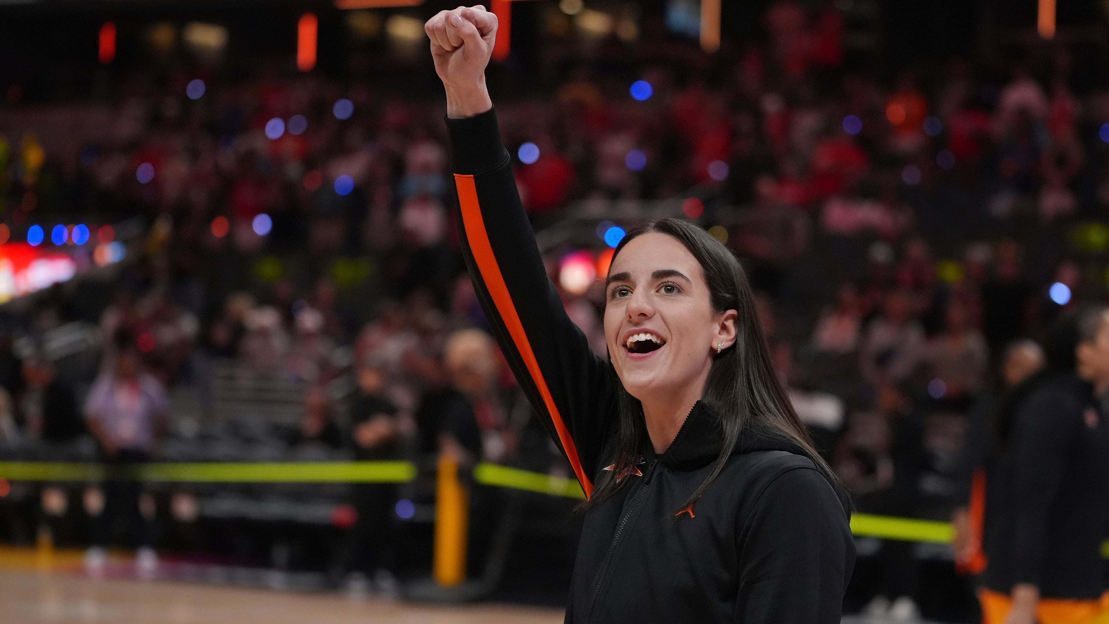 FILE - Indiana Fever's Caitlin Clark reacts to fans before the WNBA All-Star basketball game, Saturday, July 19, 2025, in Indianapolis. (AP Photo/Michael Conroy, file)