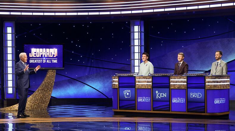 In this image released by ABC, host Alex Trebec, left, appear with contestants, James Holzhauer, center, Ken Jennings and Brad Rutter, right, on the set of "Jeopardy! The Greatest of All Time," in Los Angeles. The all-time top Jeopardy! money winners; Rutter, Jennings and Holzhauer, will compete in a rare prime-time edition of the TV quiz show which will air on consecutive nights beginning 8 p.m. EDT Tuesday. (Eric McCandless/ABC via AP)
