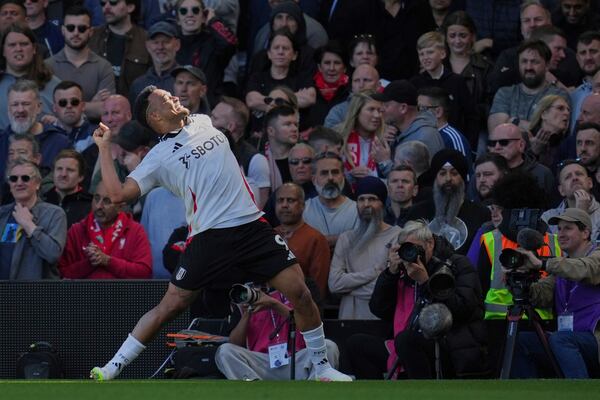 Fulham's Rodrigo Muniz celebrates after scoring his side's third goal during the English Premier League soccer match between Fulham and Liverpool, at Craven Cottage, London, Sunday, April 6, 2025. (AP Photo/Kin Cheung)