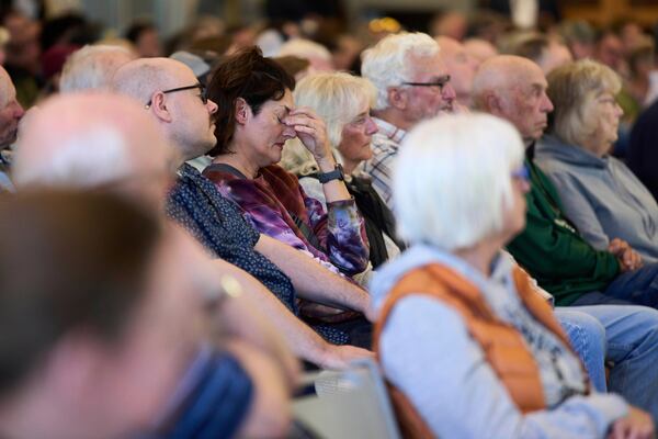 A person in the crowd reacts during a town hall event with Rep. Marie Gluesenkamp Perez, D-Wash., at Centralia College, Tuesday, April 22, 2025, in Centralia, Wash. (AP Photo/Lindsey Wasson)