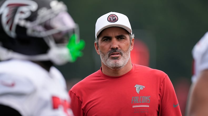 Atlanta Falcons head coach Kevin Stefanski watches the team work out during an NFL training camp, Friday, Aug. 7, 2026, in Flowery Branch, Ga. (AP Photo/Mike Stewart)